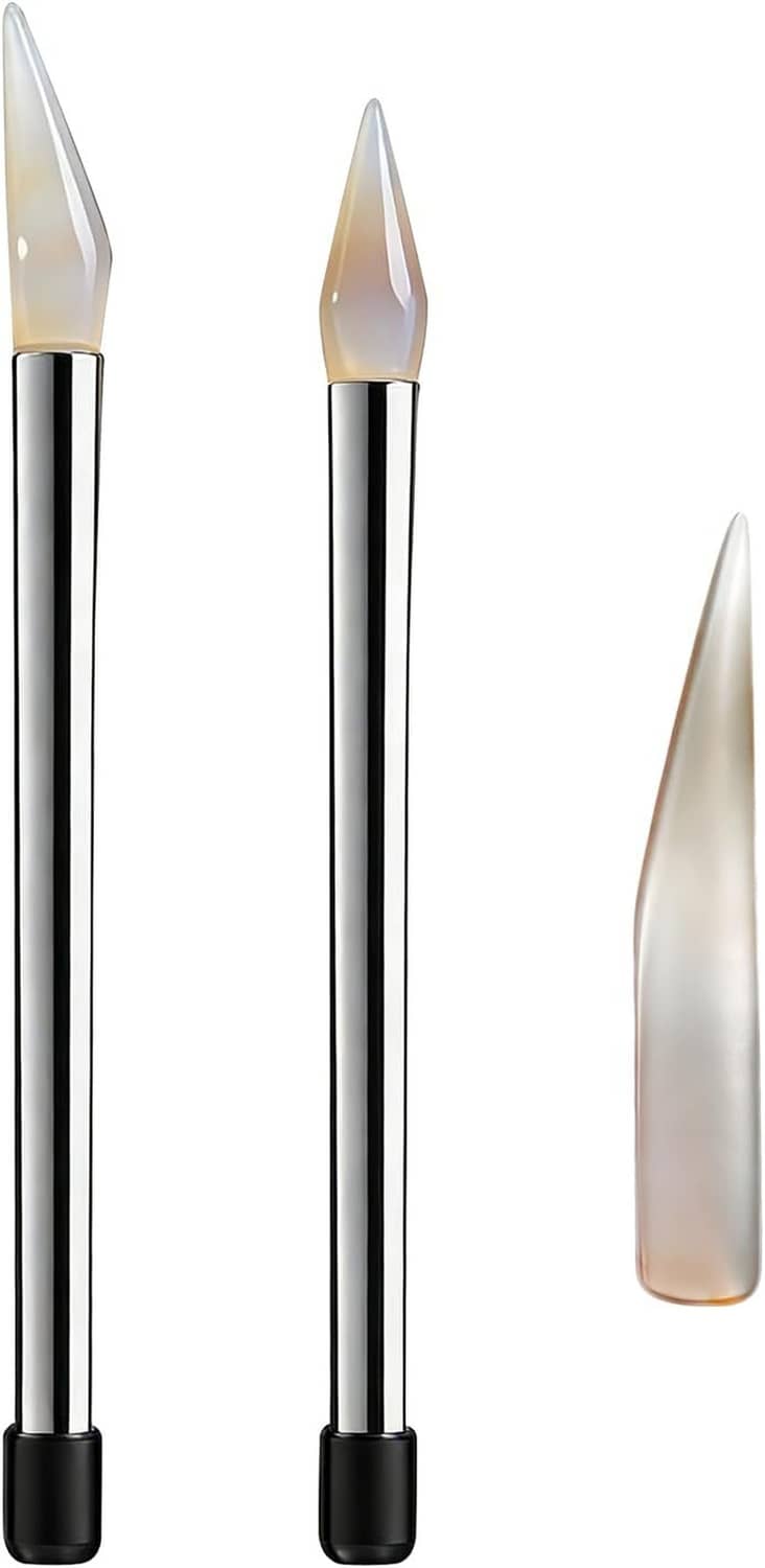Three stainless agate polishing knives with clear and gold-toned tips and black end caps