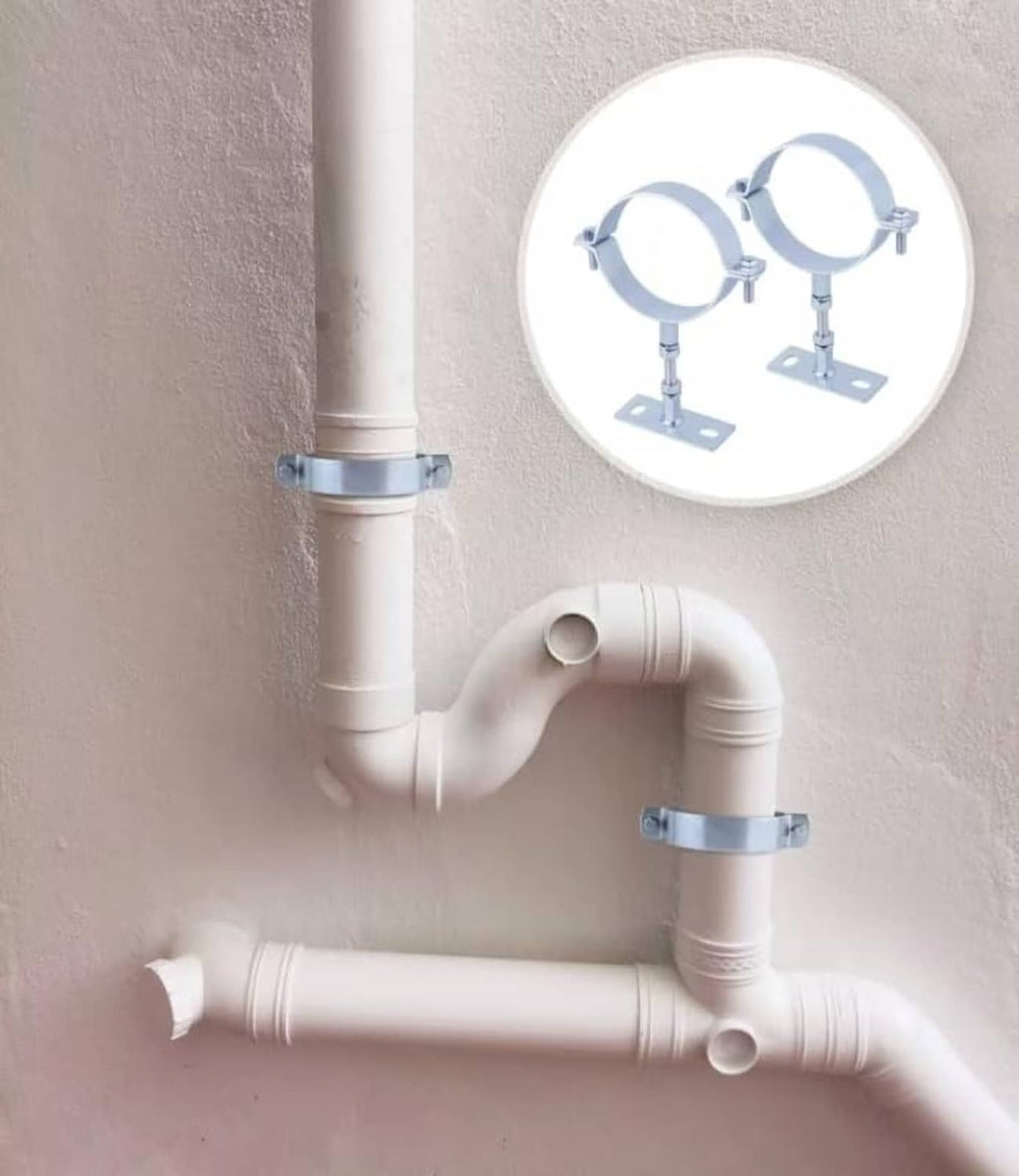 Galvanized adjustable pipe brackets securing white PVC pipes with split rings