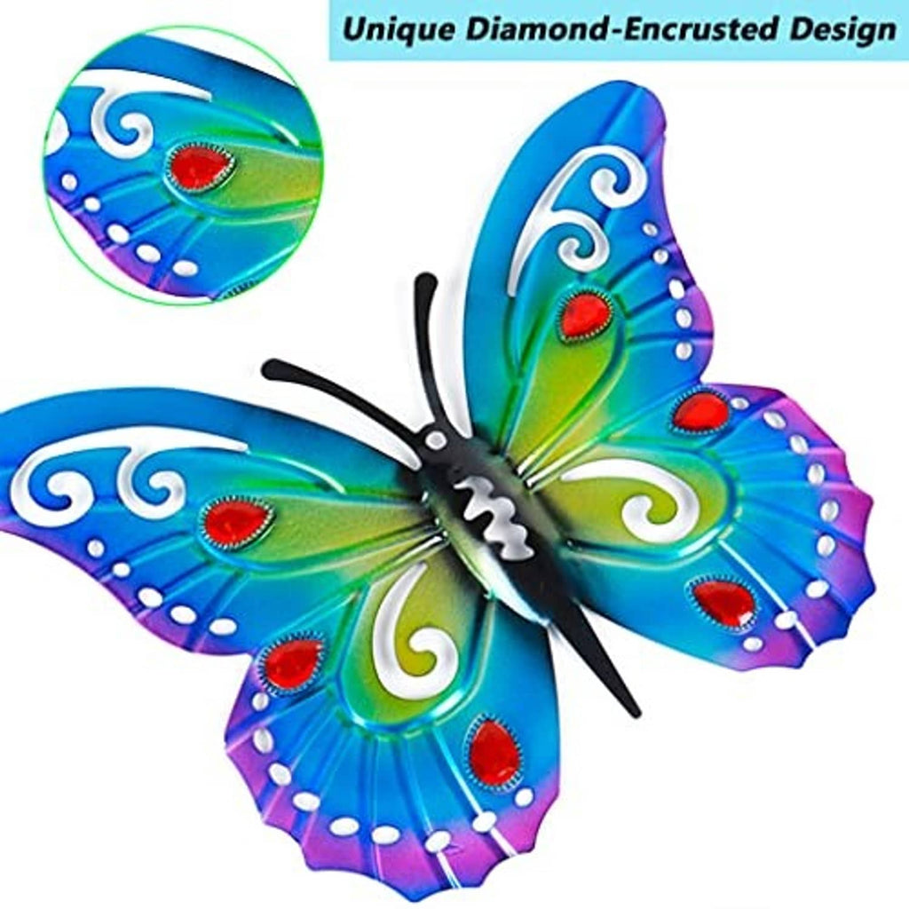Large metal butterfly decor with teal-green wings, red gems, and purple border