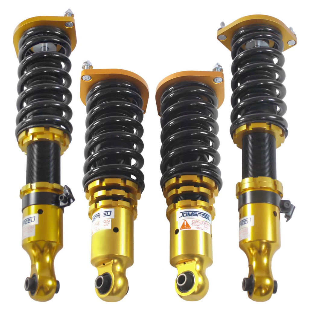 Gold coilover strut with black spring and top mount hardware, shock absorber assembly
