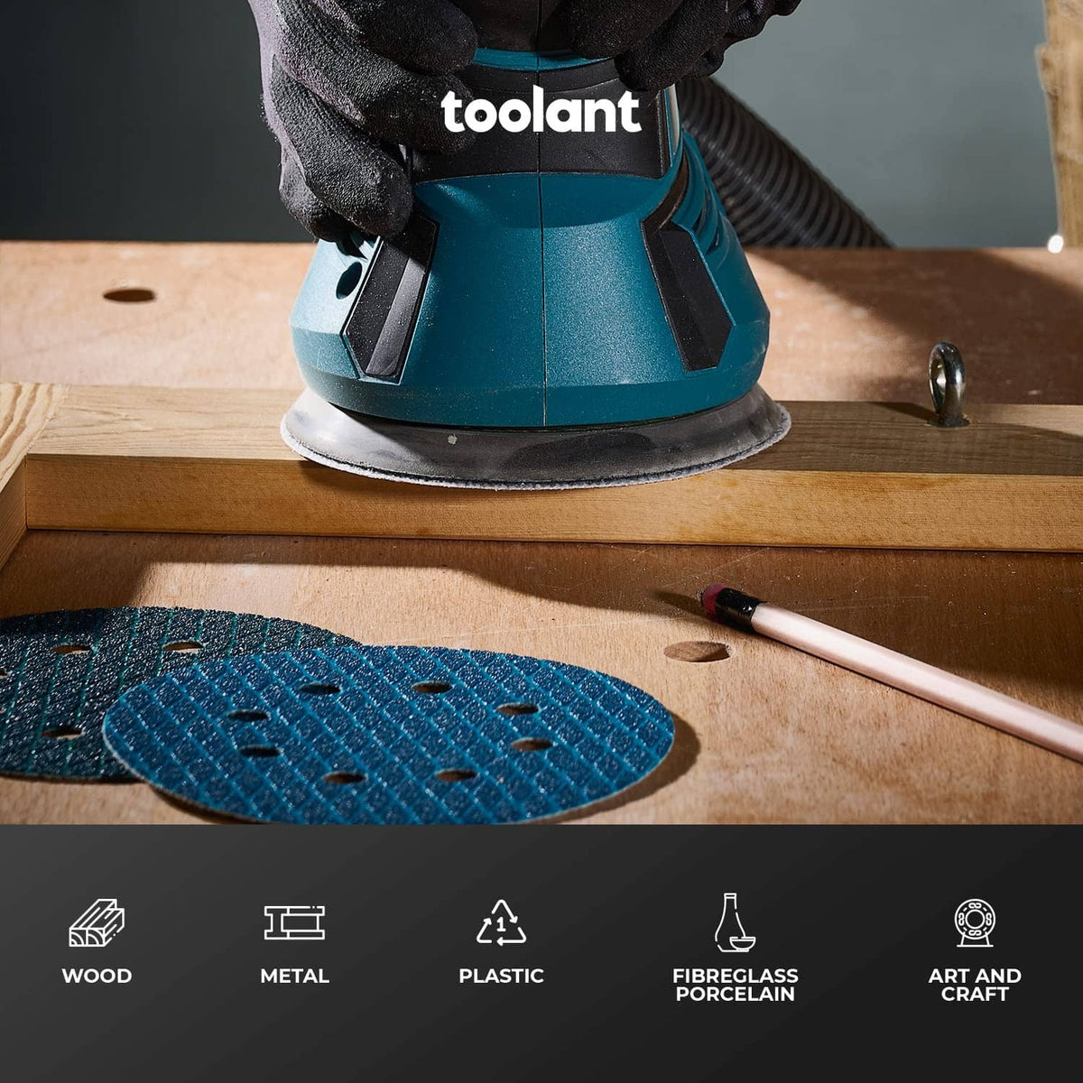 Blue 320-grit 5-inch diamond sanding disc on a power sander, sanding wood surface.