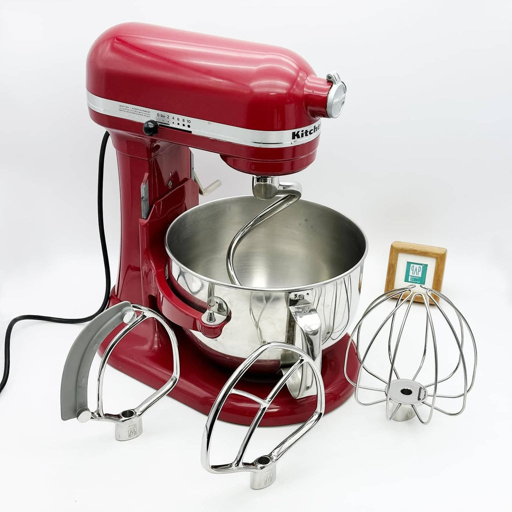 Spiral dough hook installed on red KitchenAid stand mixer with metal bowl
