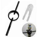 Motorcycle fork spring compressor tool kit with black ring, handle, and silver gauge fork tool