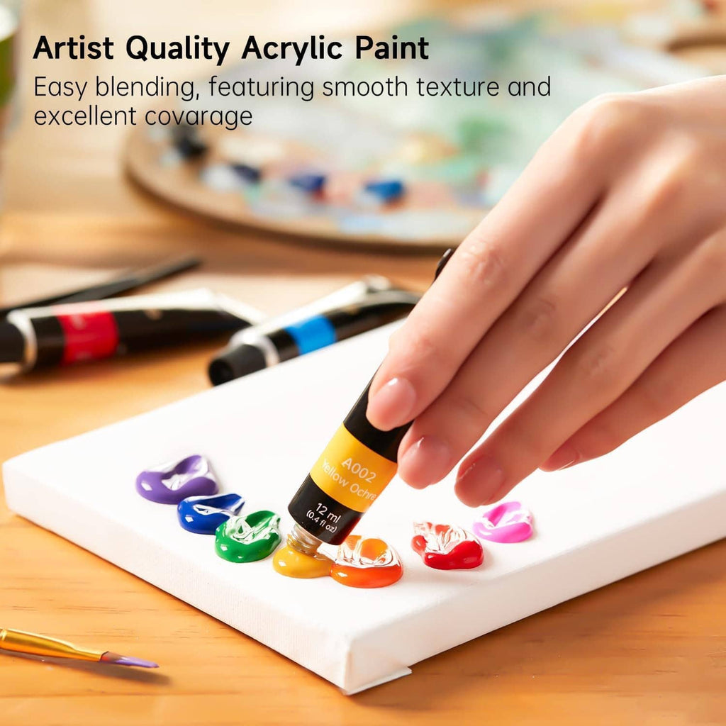 Acrylic paint set tubes with a hand painting on a small canvas