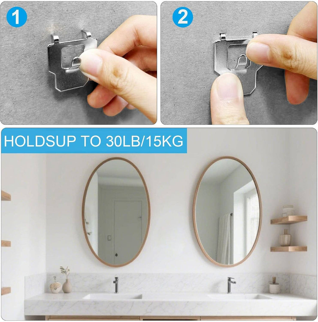 Silver claw drywall picture hanger being pressed into wall by hand