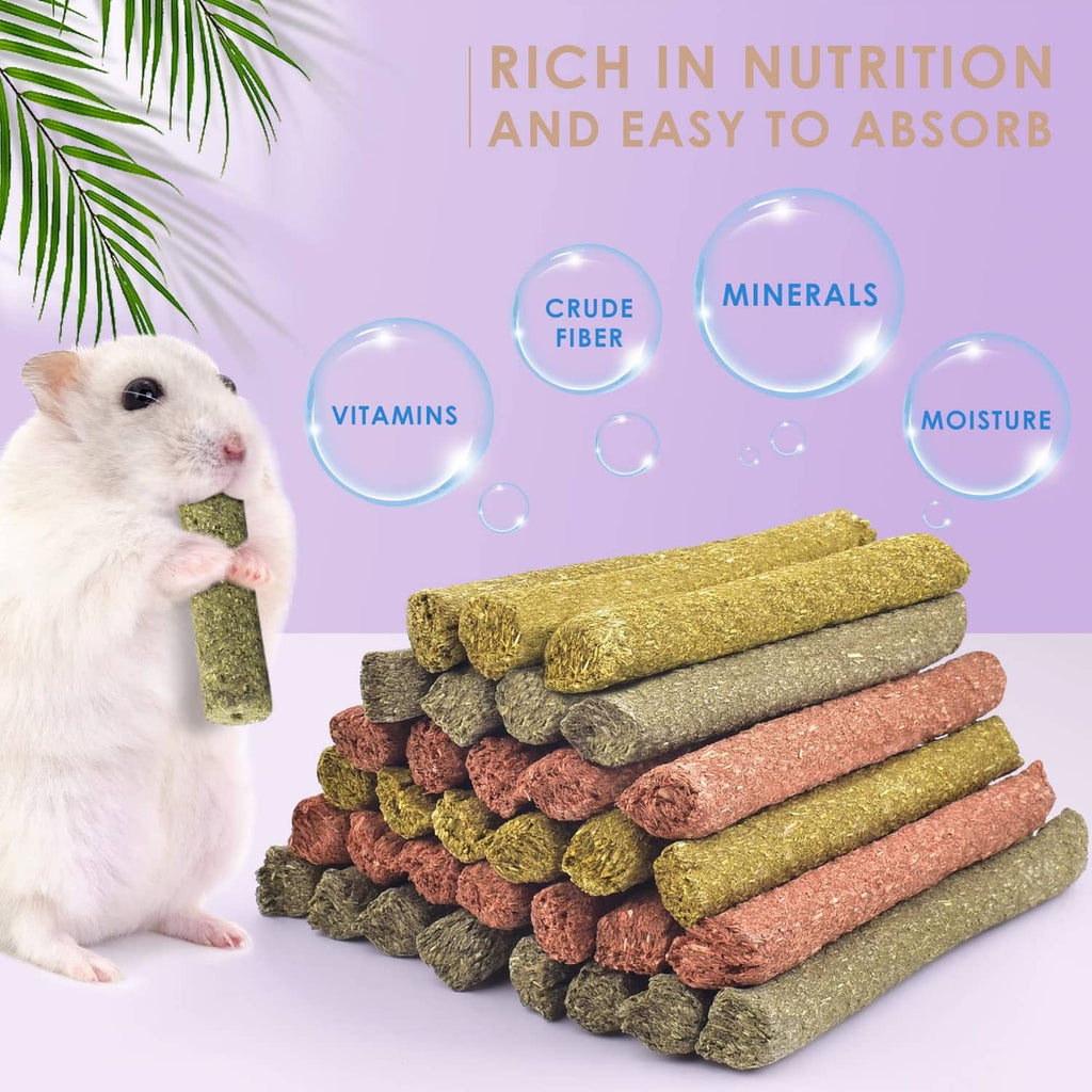 Color-mixed chew sticks for small pets, stacked with a small carrot- and hay-coated piece