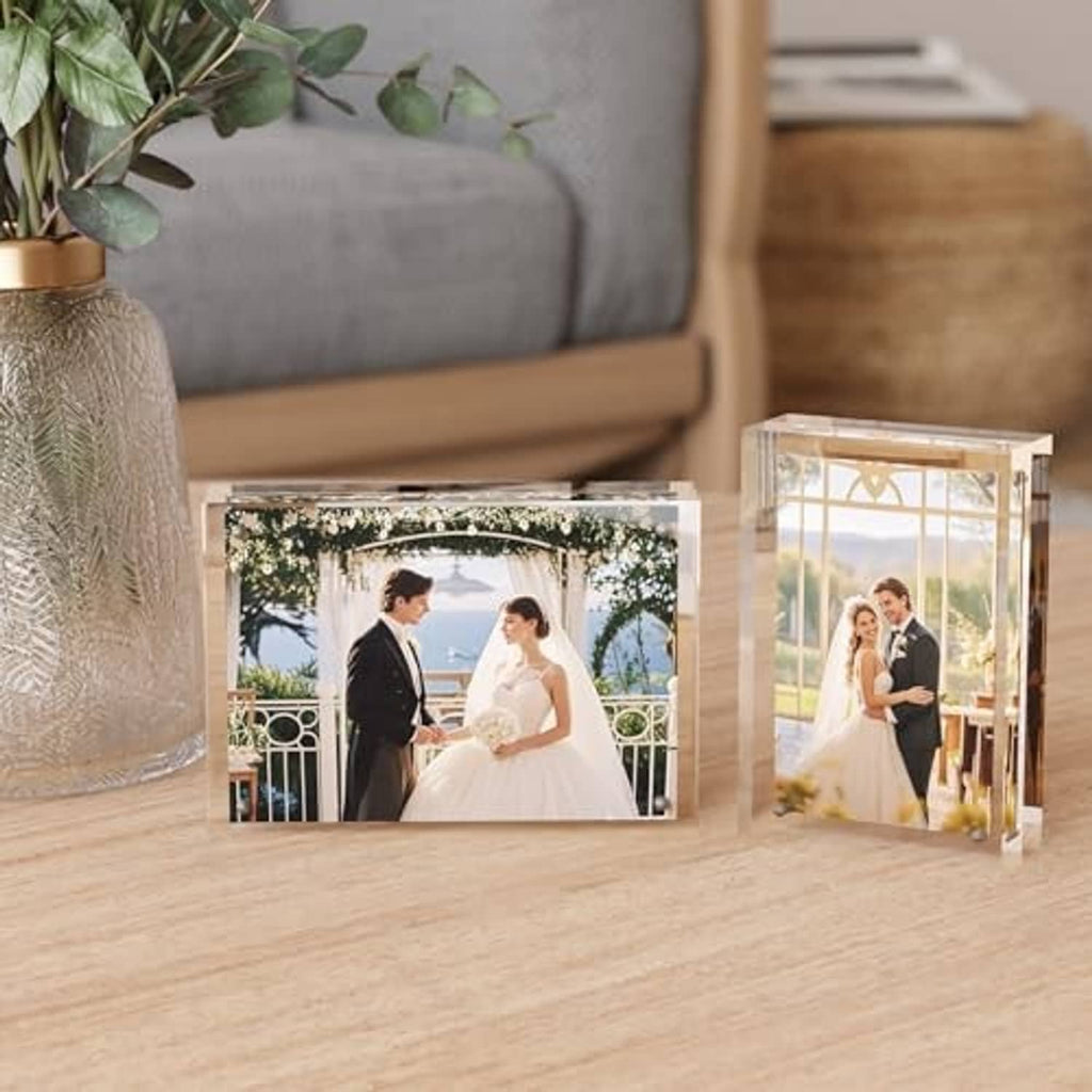 Two clear acrylic frameless 5x7 picture frames on tabletop with wedding photos displayed