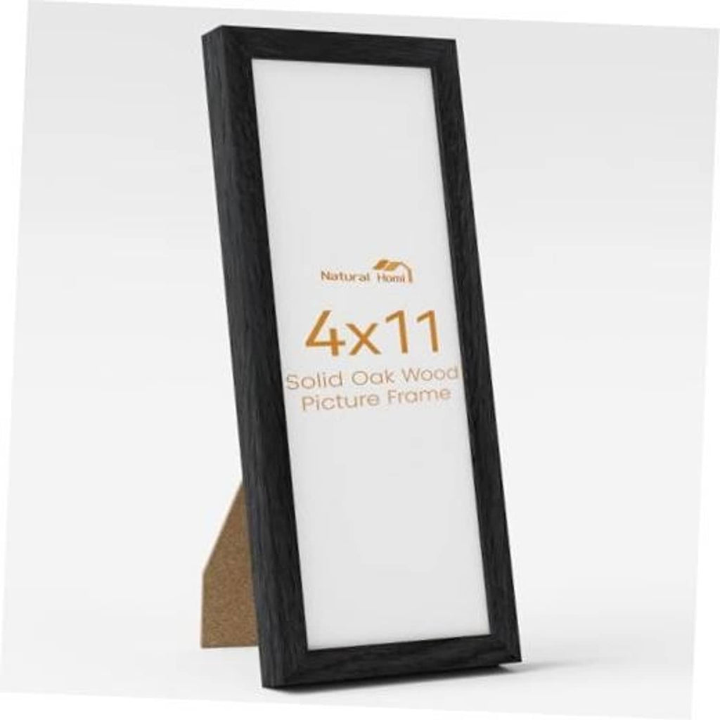 Black 4x11 solid oak picture frame with clear front glass, standing upright