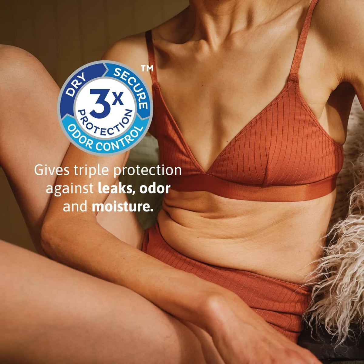TENA Sensitive Care dry protection seal on model in orange bra