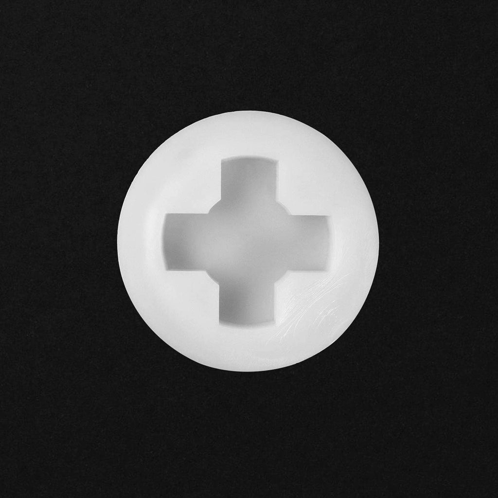 White plastic bung cap face with cross-star drive insert centered in opening
