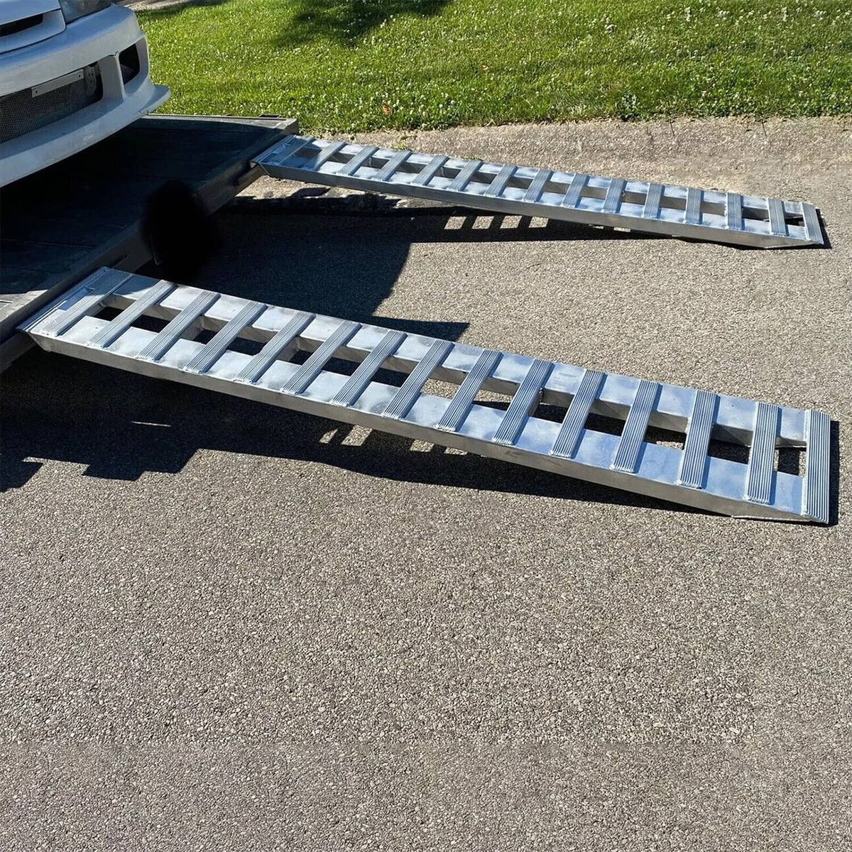 Aluminum ramps laid out in parallel for vehicle loading