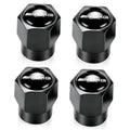 Black metal tire valve stem cap set with AMG logo, hexagonal top and rubber base