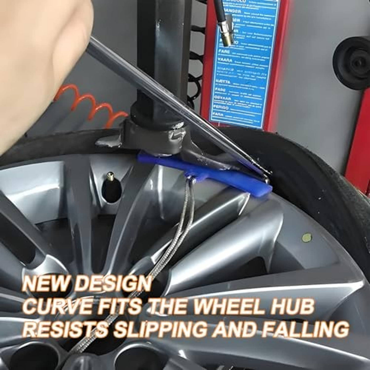 Blue rim protector positioned on a car wheel hub during tire changing