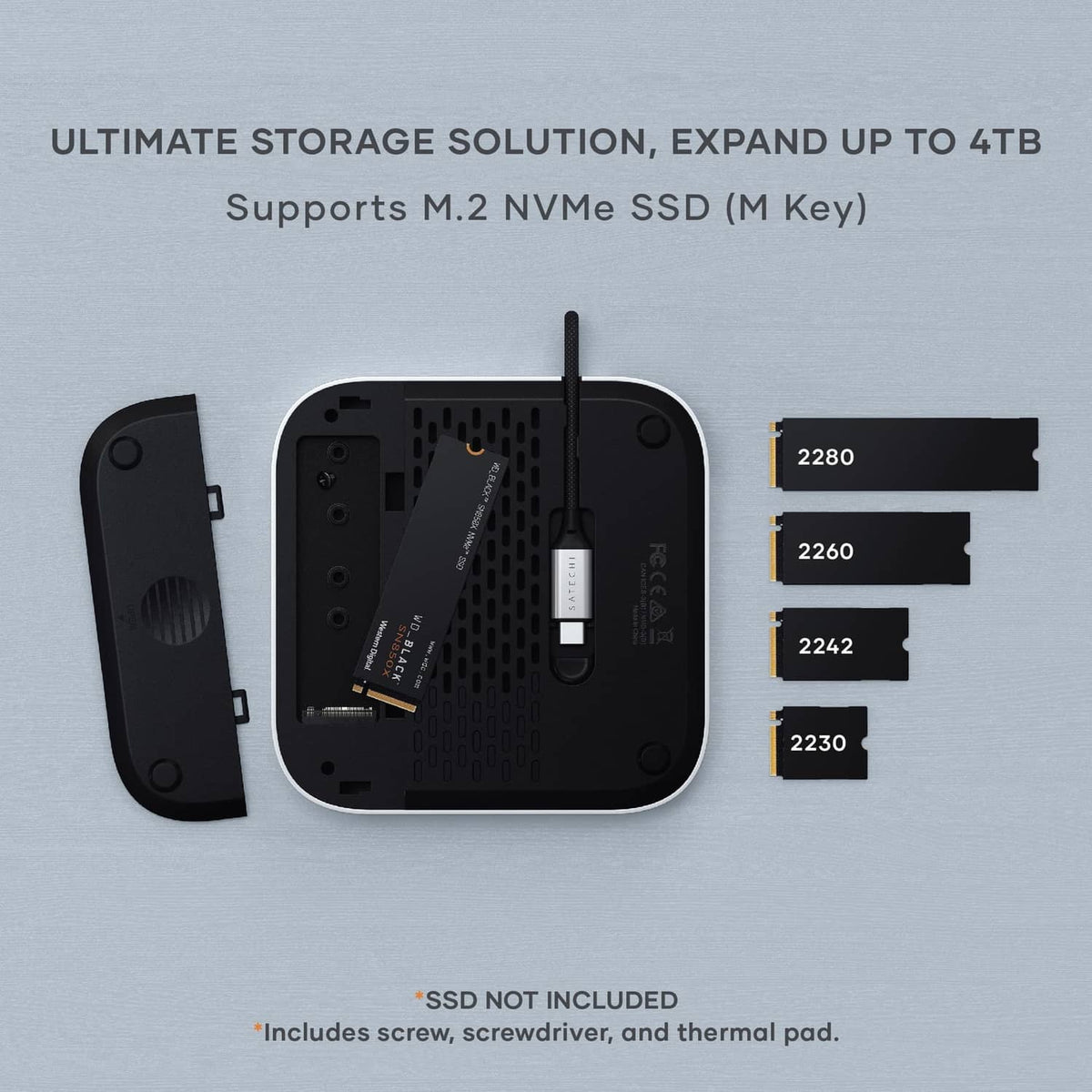 Underside of silver NVMe SSD enclosure with M.2 slots and included mounting parts