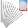 Stack of white mechanical eraser refill sticks with retail pack behind