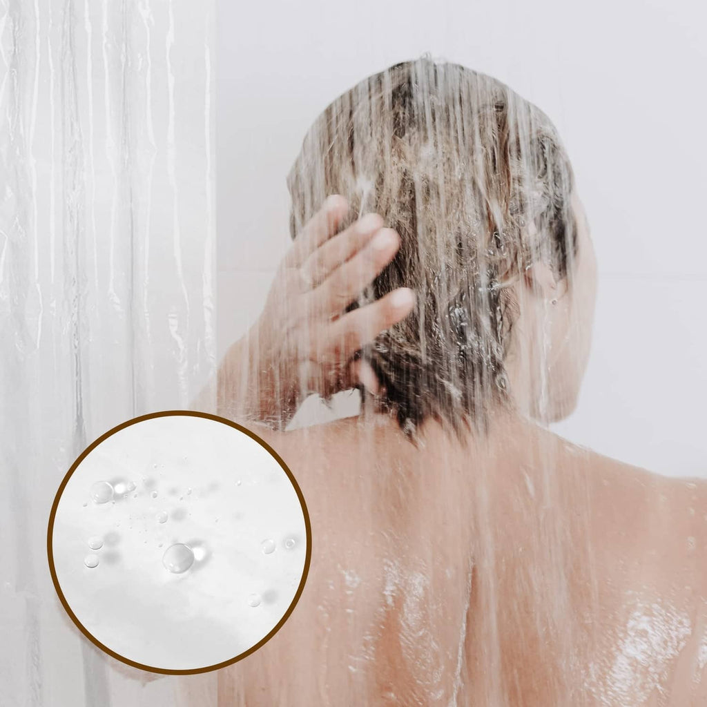 Clear shower curtain liner with water droplets beading on the surface.