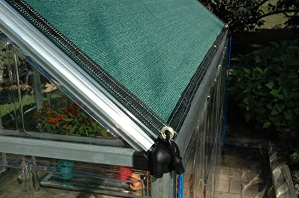 Teal shade cloth attached to metal frame with grommets for outdoor shade