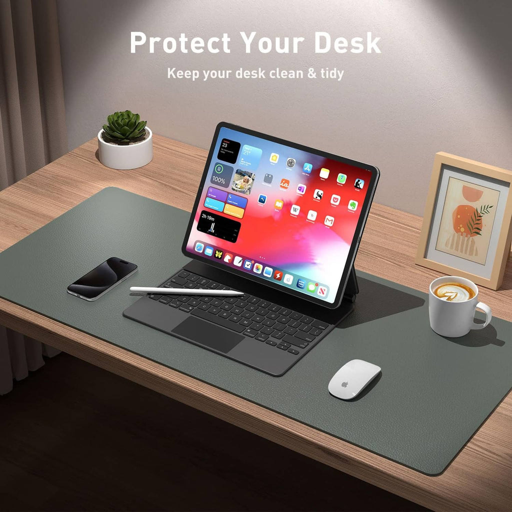 Jungle green leather desk pad protector on an office desk under a laptop