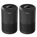 Set of two black air purifiers with circular top vents and mesh intake