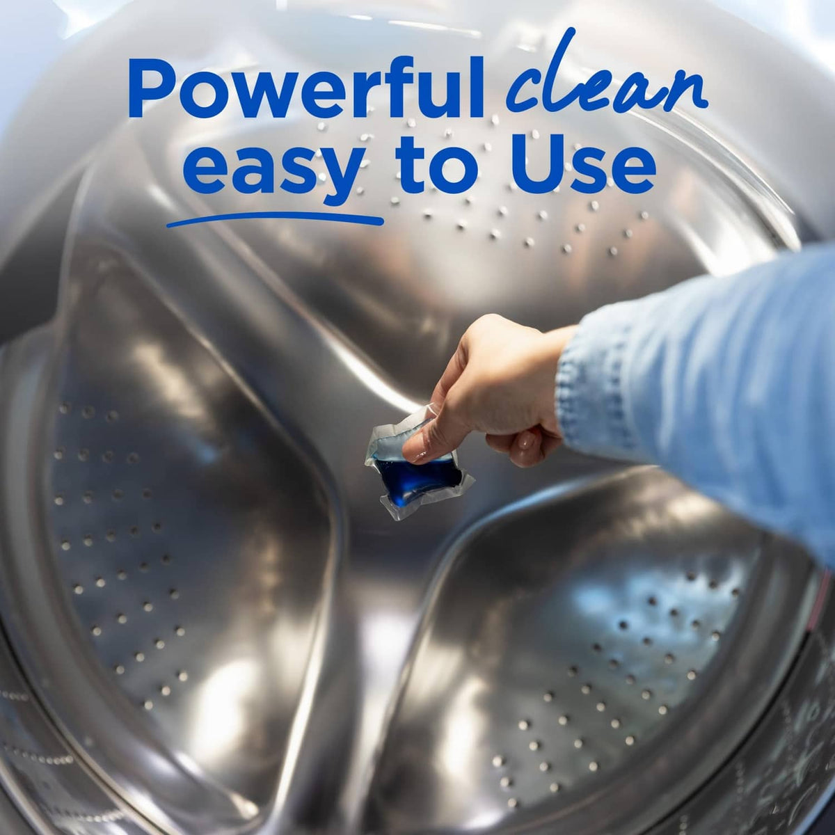 Detergent pac being added to a washing machine drum