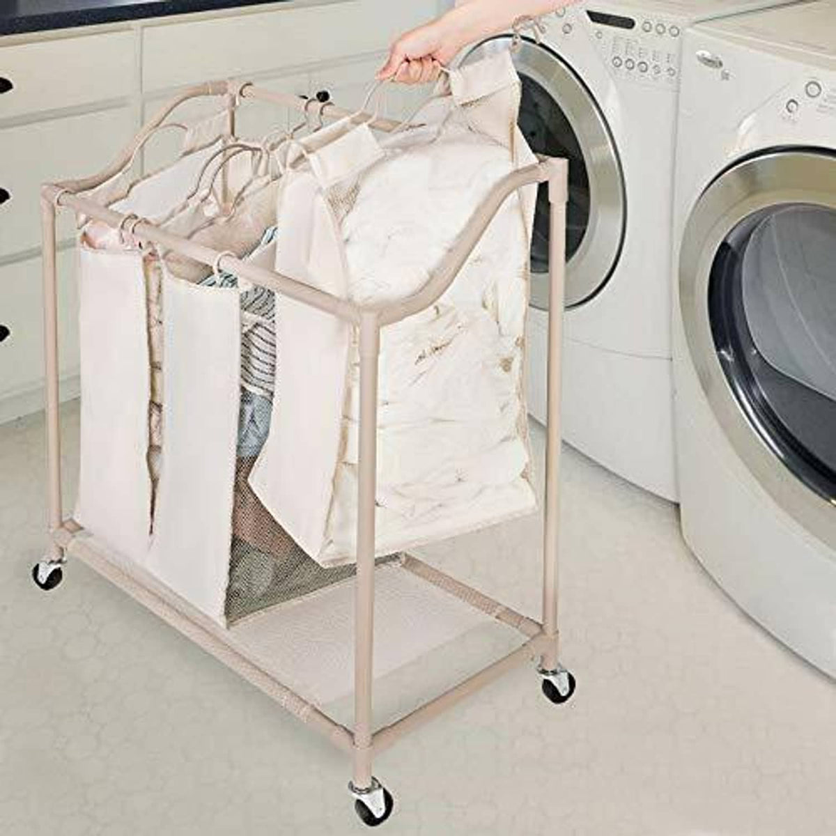 Rolling laundry sorter beside a washing machine, with three open compartments and mesh panels