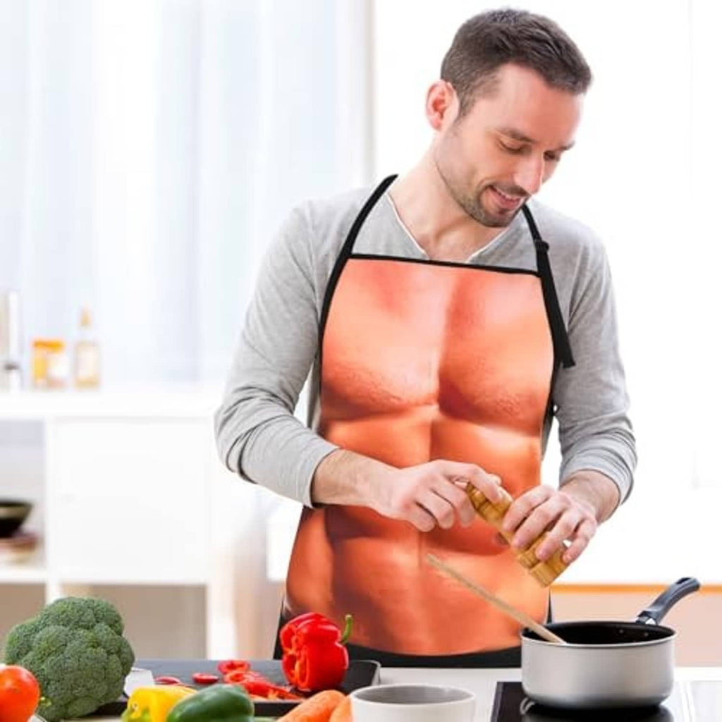 Black apron worn by man: orange muscular torso print with tied waist straps