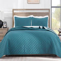 Teal reversible king-size quilt bedding set with matching pillow shams, diamond quilt pattern