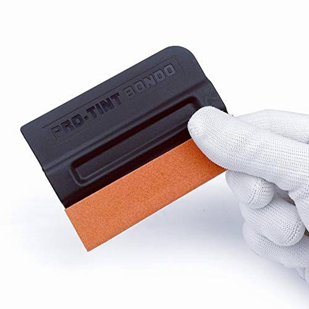 Black squeegee tool with orange felt pad held by white glove