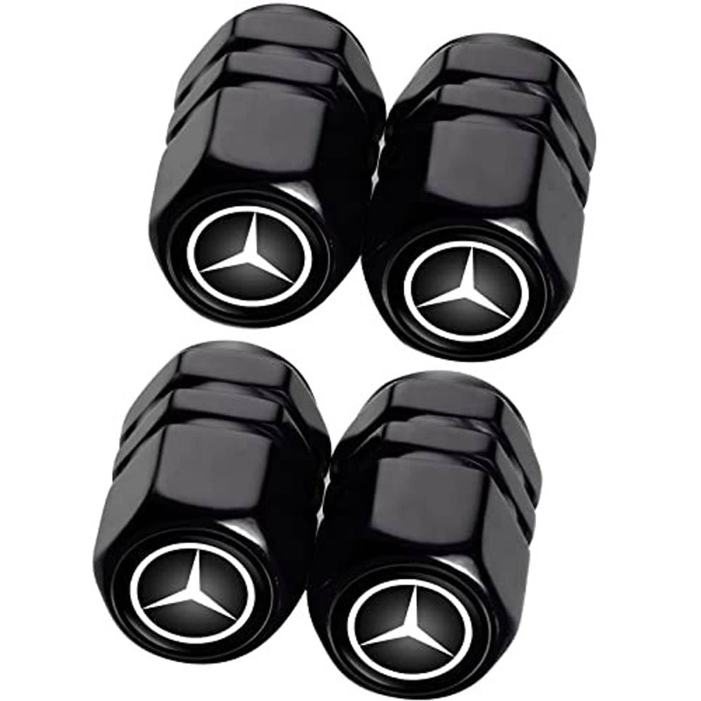 Four black valve stem caps with Mercedes logo on round, ribbed ends