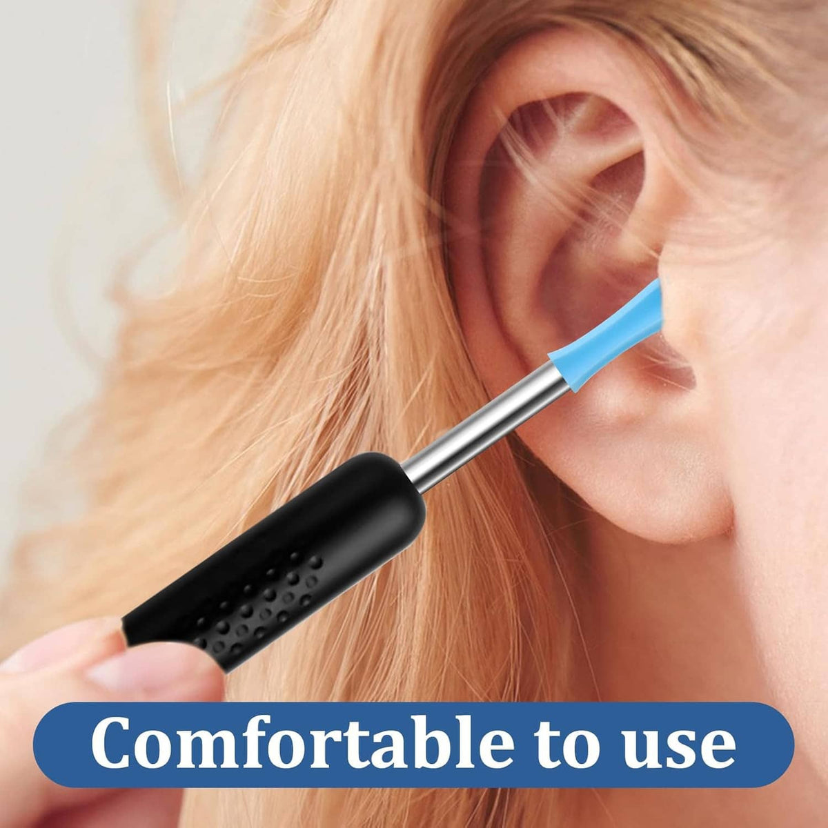 Blue ear wax removal tip on a metal handle, placed at an ear opening