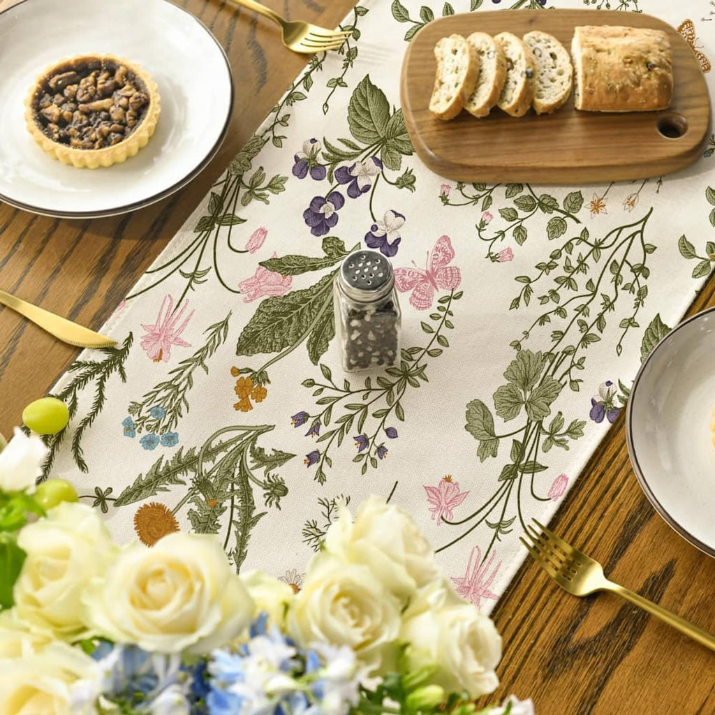 Botanical table runner with wildflowers and butterflies, view from above