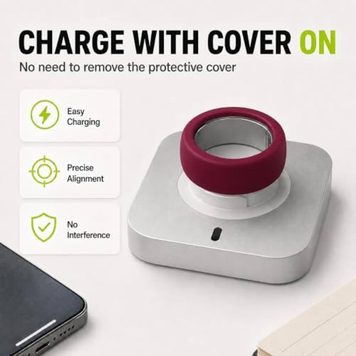 Maroon silicone ring cover on a charging base, with ring window visible