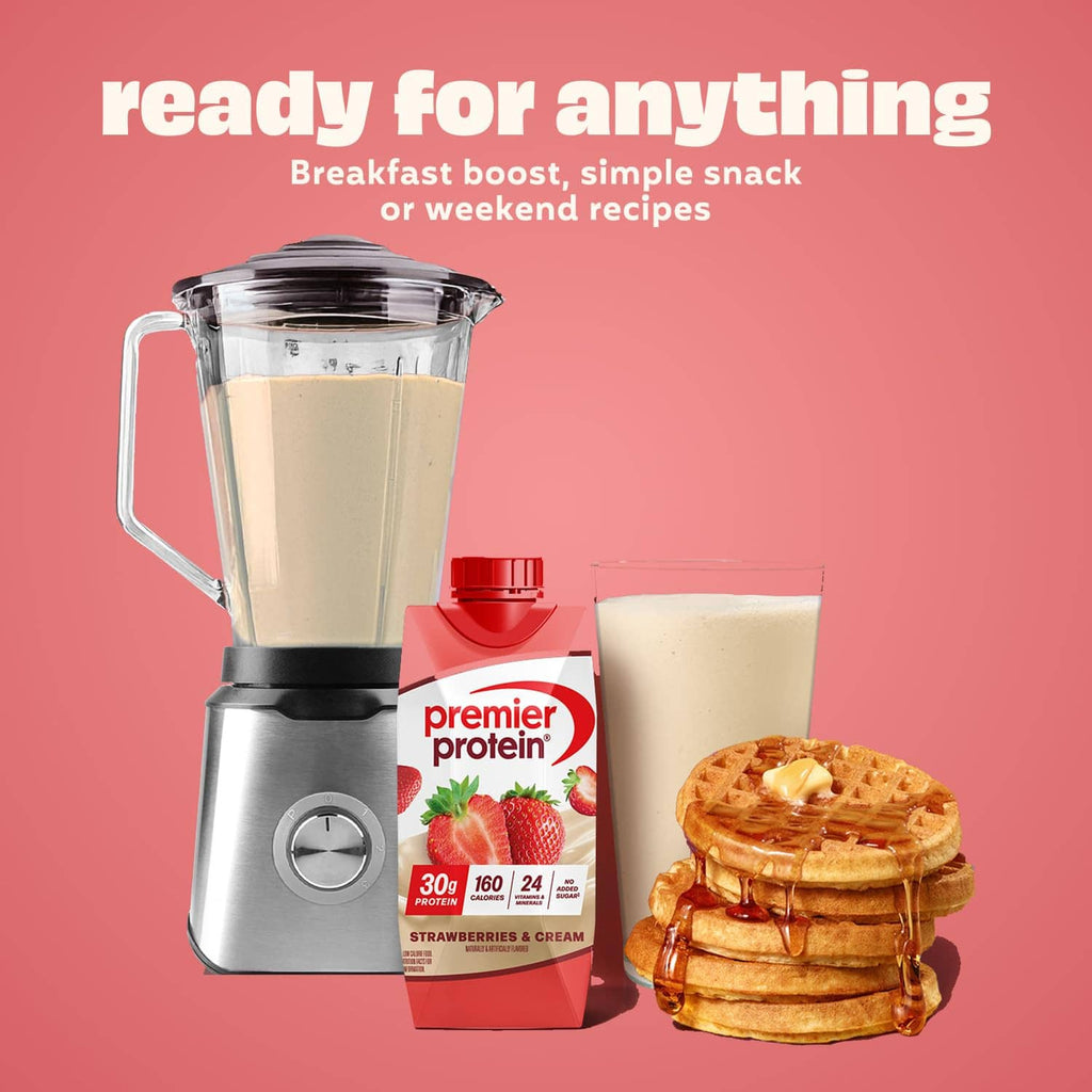 Premier Protein strawberries and cream protein shake cartons with blender and pancakes