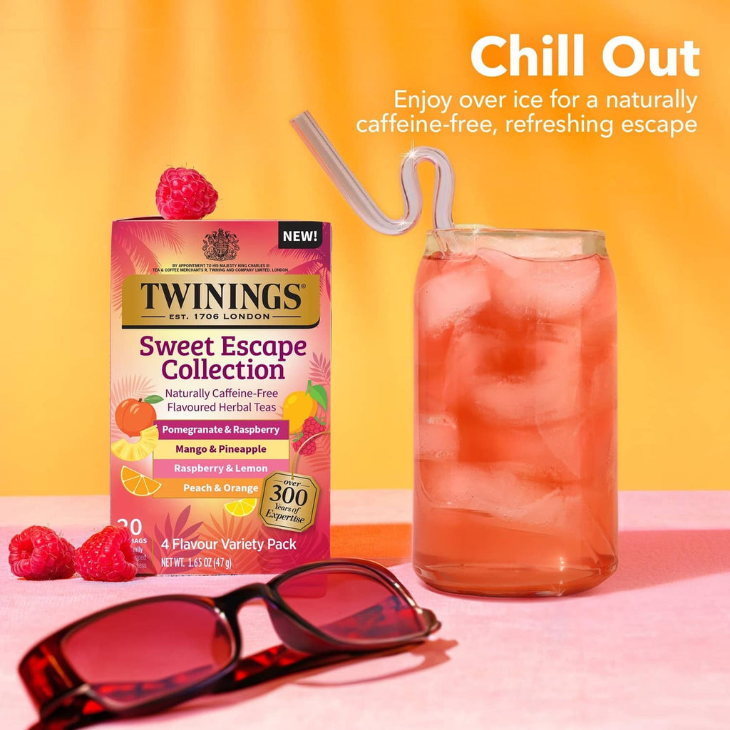 Twinings Sweet Escape Collection herbal tea pack with glass of pink iced tea