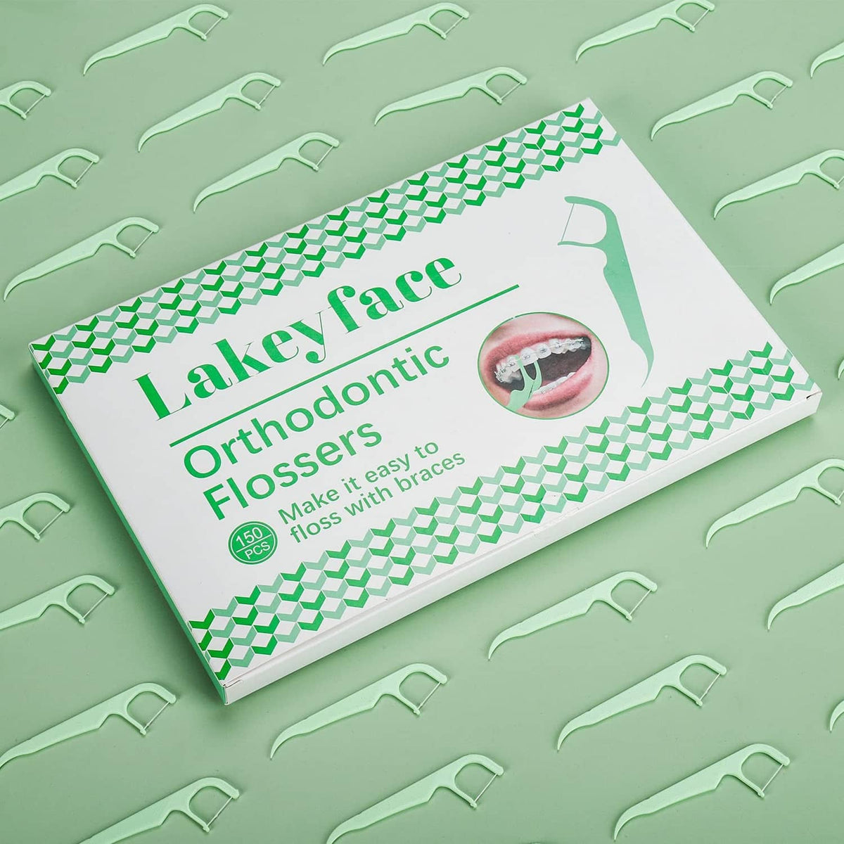 Orthodontic flosser dispenser box with green toothpick-style flossers
