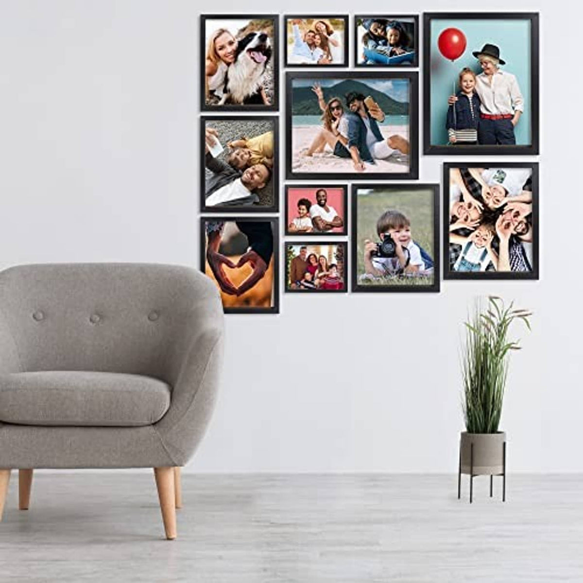 Black photo frame collage with multiple picture cards arranged in a grid on wall