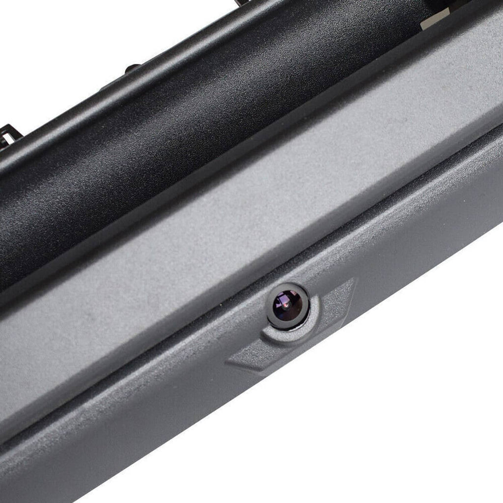 Close-up of black tailgate handle with installed rear camera lens