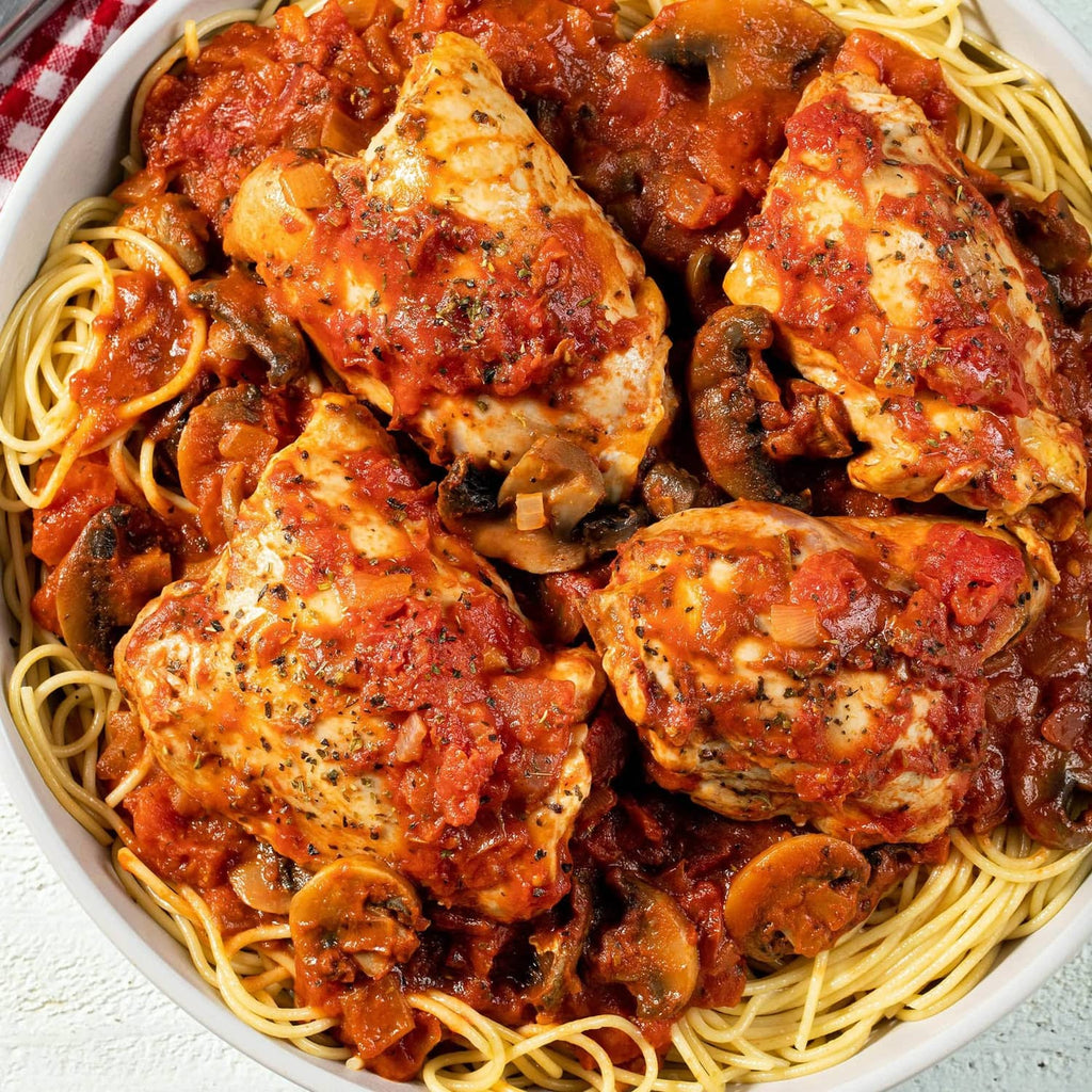 Bowl of spaghetti with Italian mushroom-style sauce, mushrooms, and meatballs