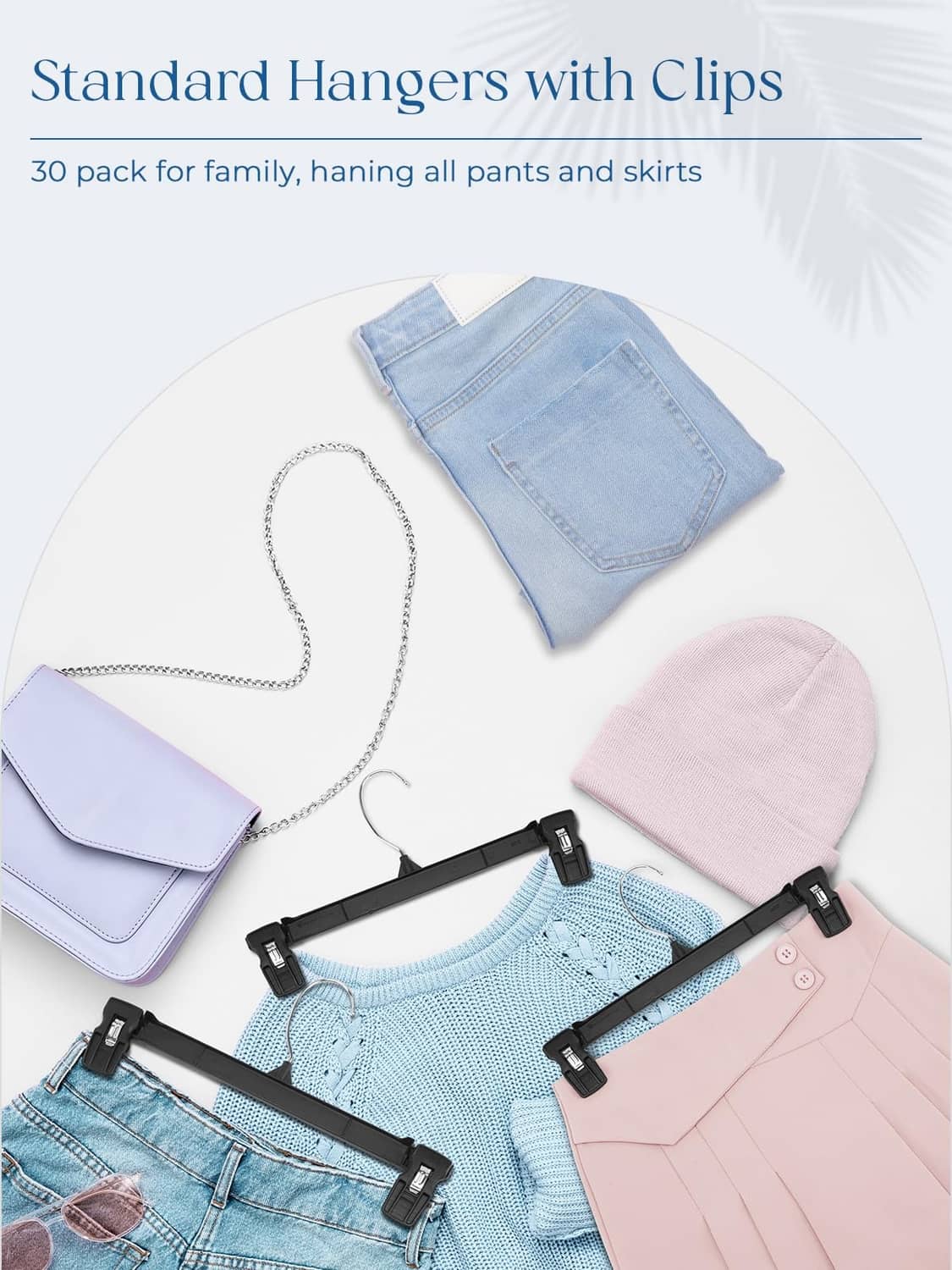 Set of black clip pant hangers with folded jeans and clothing pieces