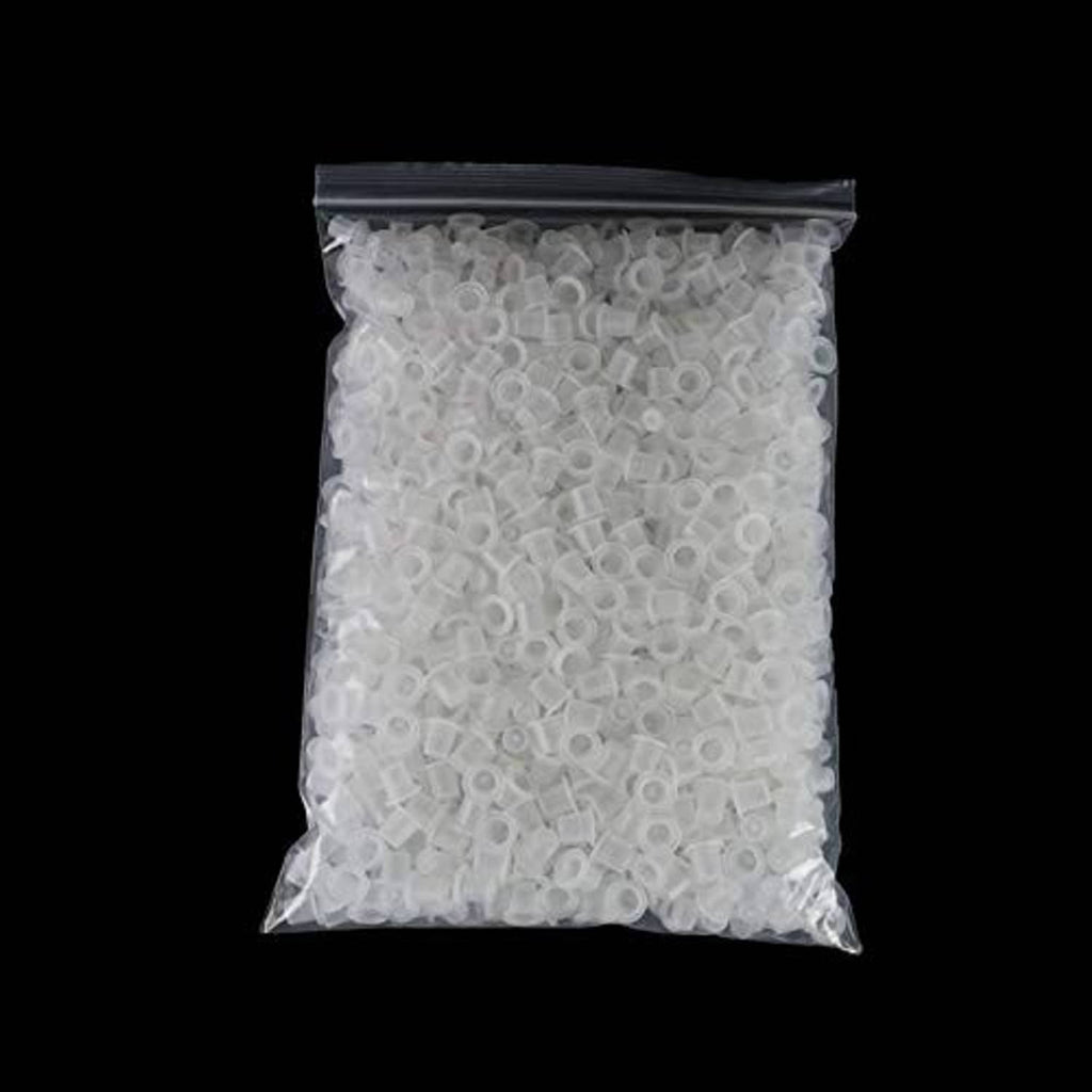Bag of disposable clear tattoo ink pigment caps, small round cups inside