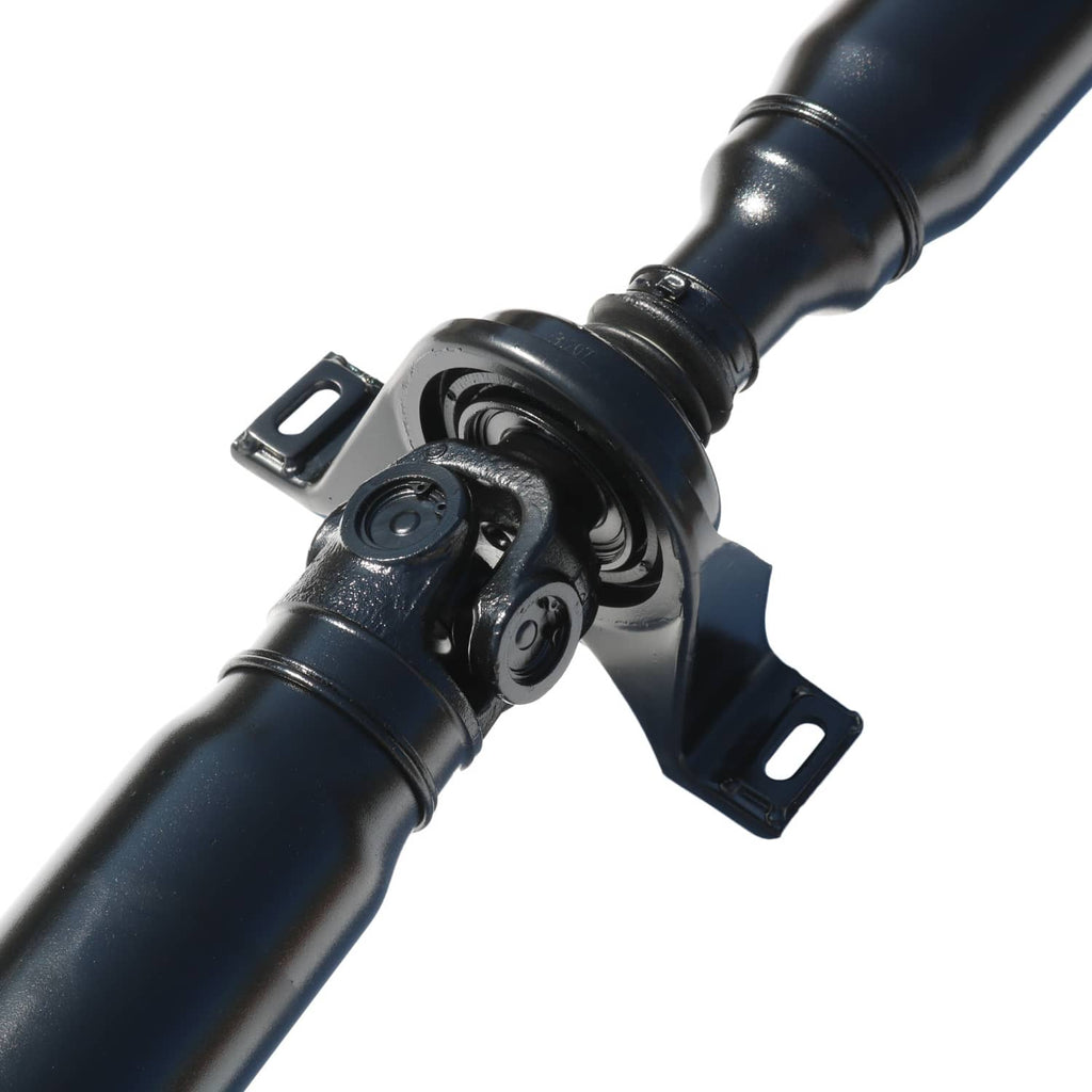 Rear drive shaft center section with universal joint yoke mounts on dark blue tube