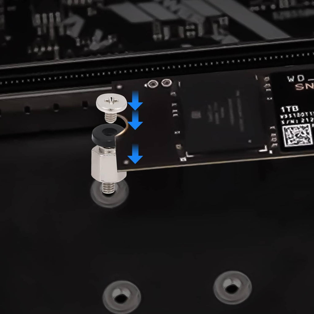 M.2 SSD mounting screws seated on motherboard, close-up