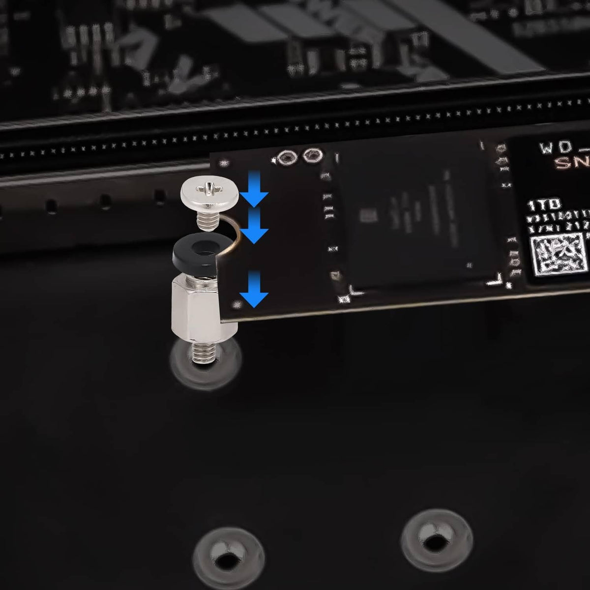 M.2 SSD mounting screws seated on motherboard, close-up