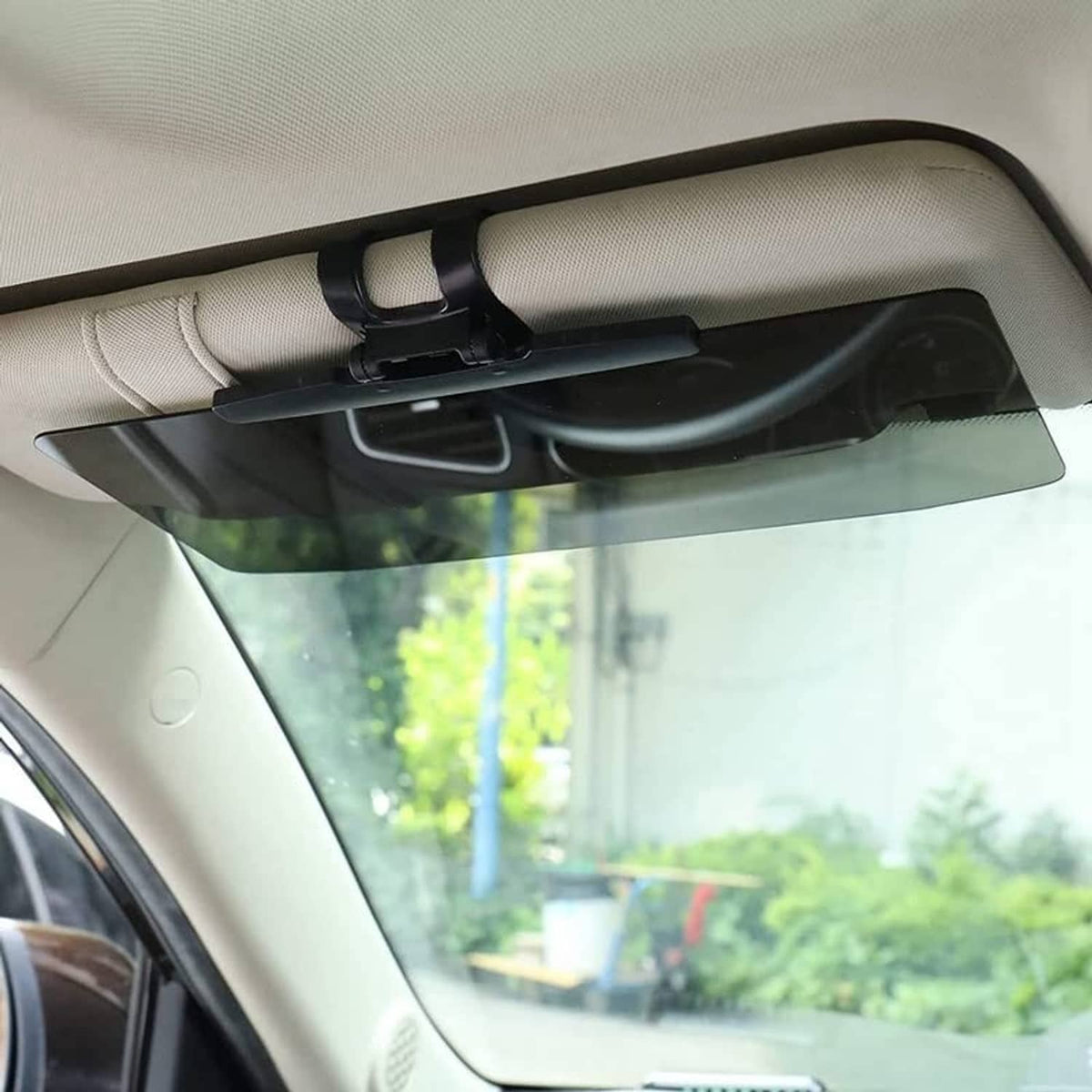 Universal car sun visor extender with dark tinted panel mounted under the visor
