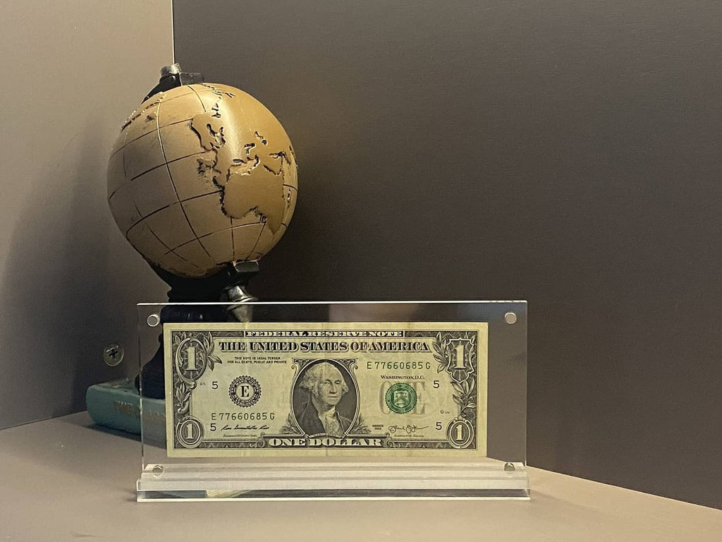Clear acrylic $1 bill display case with tabletop stand