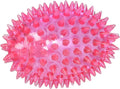 Pink spiky football-shaped squeaker dog toy with textured nubs