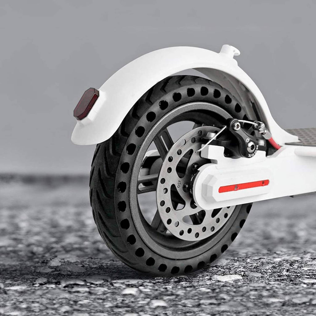 Mounted black solid scooter tire wheel with disc brake rotor detail