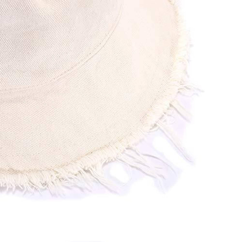 Close-up of cream cotton bucket hat brim with frayed fringe edge