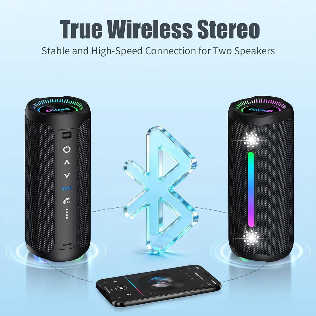 Pair of black cylindrical wireless Bluetooth speakers with RGB LED accents and phone nearby