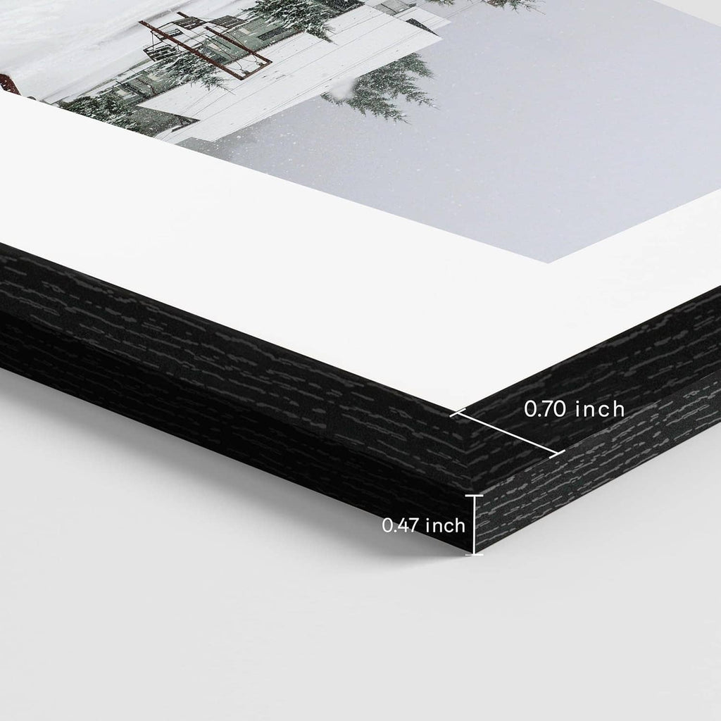 Black 12x12 picture frame corner showing layered depth and clear acrylic cover.